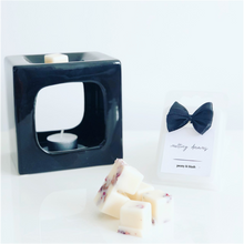 Load image into Gallery viewer, Luxury botanical peony &amp; blush wax melts with a white label and black wax burner. 
