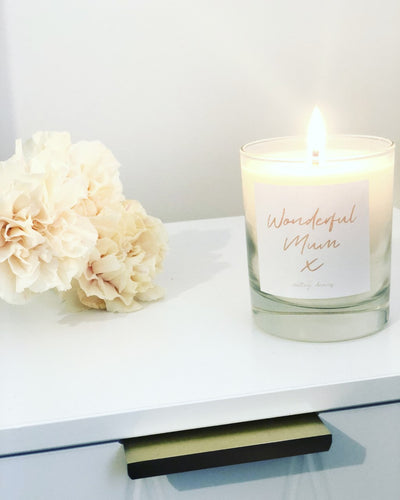 Unwind luxury wonderful mum candle with pink text. 